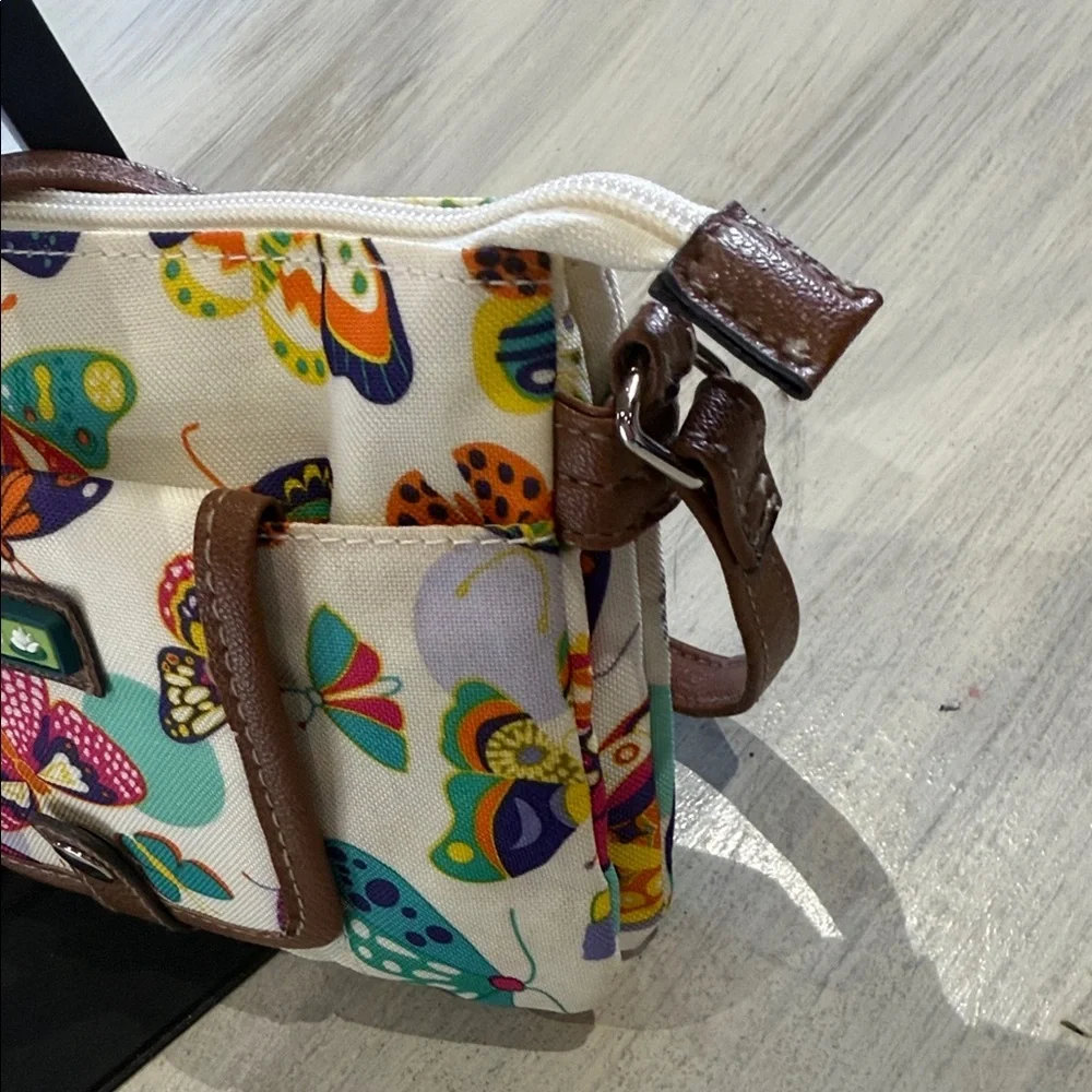Lily Bloom Cream Crossbody Bag with Multicolor Butterfly Print and Brown Trim - Picture 4 of 12